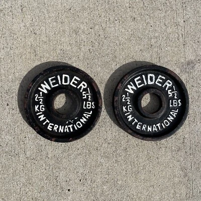 Par de placas de peso olímpicas vintage Weider International 2,5 kg 5,5 lb Foto 1 de 3