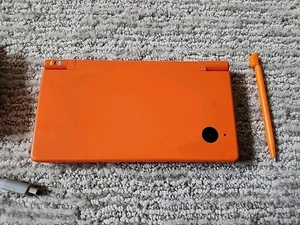 Nintendo DSi Orange Handheld system Console W/Charger Tested Works Ships FAST! - Picture 1 of 5