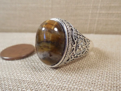 Anillo de calidad grueso tono plata ojo de tigre talla 11 1/4 R Foto 1 de 4