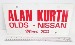 Alan Kurth Oldsmobile Nissan Minot North Dakota Auto Dealership License Plate - Picture 1 of 5