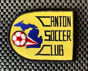PARCHE BORDADO COSIDO CLUB DE FÚTBOL CANTON MICHIGAN 4" X 3" NUEVO DE STOCK - Imagen 1 de 2