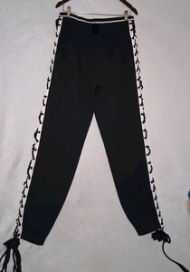 Pantalones deportivos Puma Fenty by Rihanna con cordones blancos y negros bolsillos para mujer talla M - Imagen 1 de 20