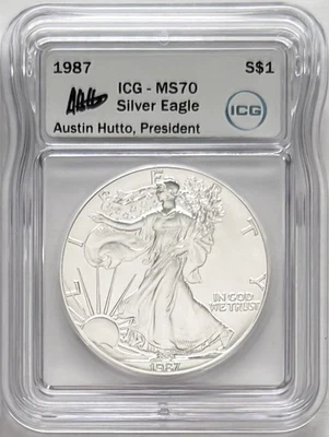 1987 SILVER EAGLE ICG MS70 AUSTIN HUTTO, PRESIDENT HAND SIGNED - Image 1 of 2