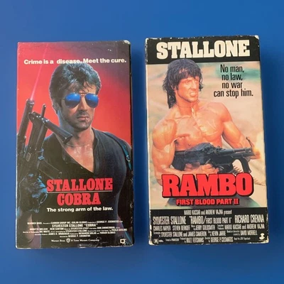 Lot (2) Sylvester Stallone VHS Tapes Cobra & RAMBO First Blood Pt2 Vintage HTF - Image 1 of 4