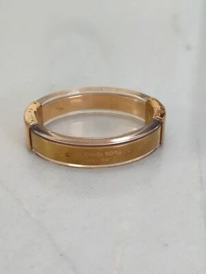 BRAZALETE BRAZALETE MICHAEL KORS TONO DORADO + ACETATO ACRÍLICO TRANSPARENTE  Foto 1 de 4