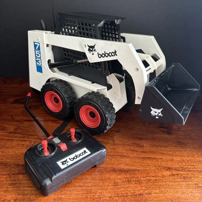 Minicargadora radiocontrolada Bobcat 753 juguetes REMOTO y cargador no funciona Foto 1 de 4