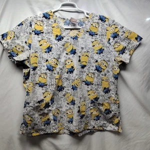 Top exfoliante Despicable Me XL para mujer cuello en V bolsillos laterales divididos minions - Imagen 1 de 11