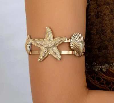 Brazos estrella de mar concha de mar Foto 1 de 2