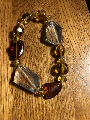 Pulseira de contas elásticas facetadas âmbar e transparente - Imagem 1 de 2