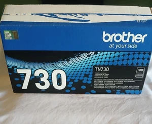 Oryginalny czarny toner Brother TN730 - otwarte pudełko, uszczelniony wkład - Zdjęcie 1 z 2