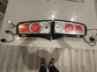 Juego de luces traseras originales 04-06 Scion XB NCP31 OEM TYC Foto 1 de 4