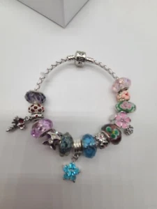 Pandora Armband aus weißem Lederseil mit 14 Mops & europäischen Charms - Bild 1 von 10