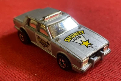 HOT WHEELS Macchinina Auto SECURITY PATROL Mattel (1986) 1:64 Flip funzionante - Immagine 1 di 3