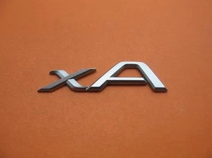 2005 SCION XA REAR TRUNK LID EMBLEM LOGO BADGE SIGN SYMBOL OEM USED 04 05 06 #4 - Bild 1 von 4