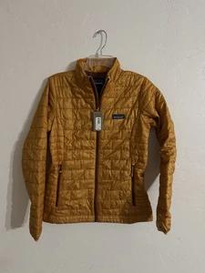 Neu mit Etikett Patagonia Damen Nano Puff Gold/Orange Jacke Größe S - Bild 1 von 4
