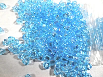 100 Miyuki Transparent AB Iris LIGHT AQUA BLUE Glass TRIANGLE BEADS - Image 1 of 2