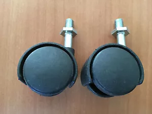 TWO (2) PLASTIC 1.25" SWIVEL CASTERS - Imagen 1 de 1