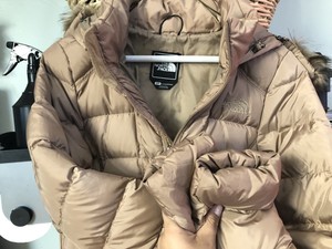 gold north face jacket