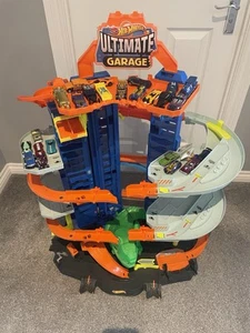 Hot Wheels Ultimate Garage Playset with Multi-Level Racetrack Tall Moving T-Rex - Picture 1 of 5