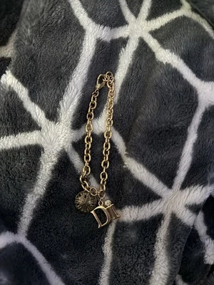 Pulsera Christian Dior Charm Vintage Rara Di Sand Dollar tono dorado Foto 1 de 2