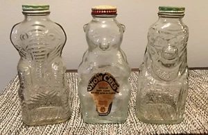 Tres bancos de personajes de vidrio vintage. Elefante, oso, payaso. Grapette/Snowcrest - Imagen 1 de 4