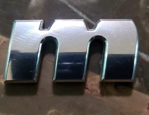 Nissan Nismo Emblem Symbol Sign Logo Insignia Oe Genuine Wording Letter "M" - Picture 1 of 3
