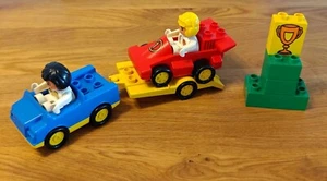 LEGO DUPLO 2671 Racing Team, Rennauto Auf Hänger, Formel 1, Pokal, Figuren - Bild 1 von 3