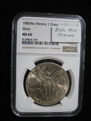 1985 MEXICO SILVER ONZA LIBERTAD NGC MS 66 ROLL END TONING! - Image 1 of 3