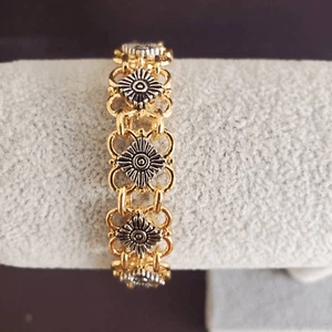 Pulsera de dos tonos con flores plateadas en montura de relleno dorado - Imagen 1 de 6