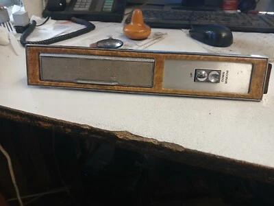 Oldsmobile 1985 reposabrazos de puerta cenicero interruptor de ventana con bisel grano de madera usado Foto 1 de 4