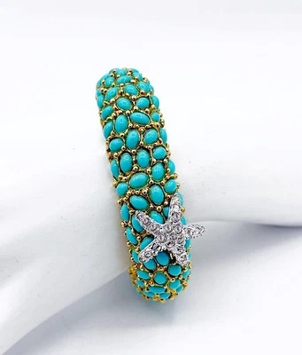 Brazalete firmado Kenneth J Lane tono dorado estrás estrellas de mar y turquesa Foto 1 de 4