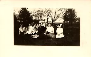 Postcard RPPC Victorian Women And Children Sit In Field Have Picnic And Lounge - Picture 1 of 2