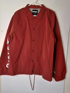 Giacca a vento Oakley rossa personalizzata grande stampa logo sulle maniche taglia 2XL - Foto 1 di 8
