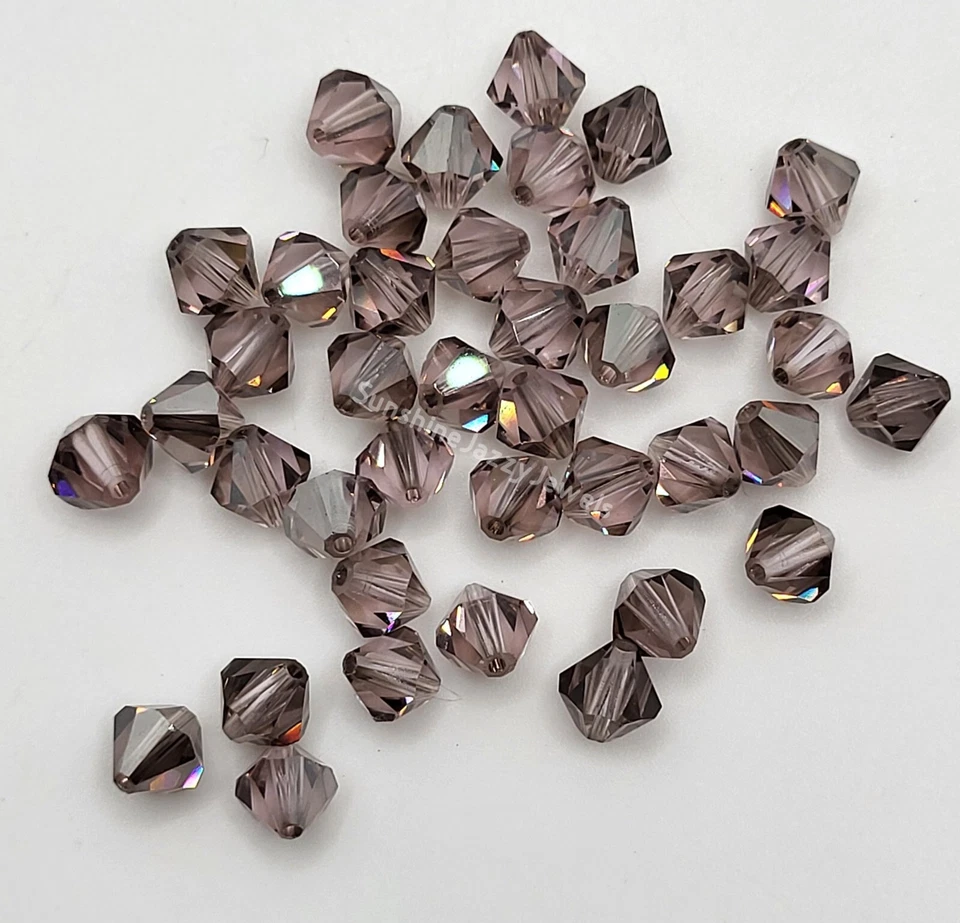 Cuentas bicónicas de 6 mm satinadas amatista clara de cristal Swarovski de 12 piezas; tinte gris mate Foto 1 de 1