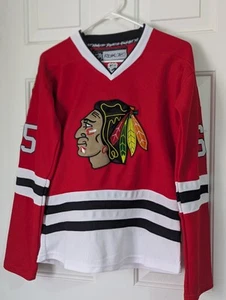 Maglia NHL Chicago Blackhawks CCM Reebok Shaw #65 media rossa ricamata - Foto 1 di 9