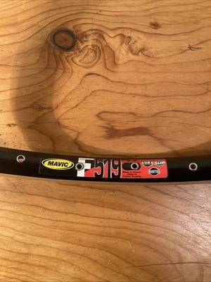 One Vintage NOS Mavic F 517 32h Black 26 Inch Rim Brake Single - Image 1 of 4