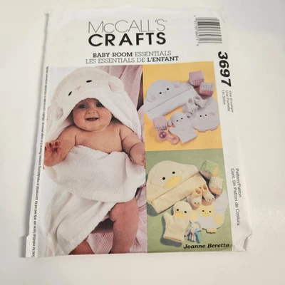 McCall's Crafts 3697 Baby Room Essentials Sewing Pattern Hooded Towels Bibs Toys - Image 1 of 2
