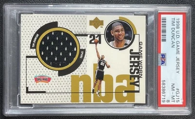 TIM DUNCAN PSA 8 1998-99 UPPER DECK #GJ15 GAME WORN JERSEY 6719 - Image 1 of 2