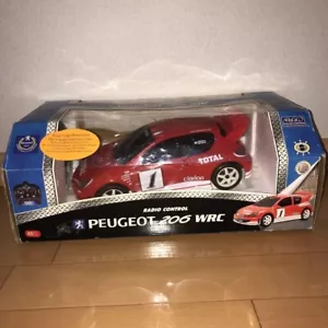 NIKKO Radiocomando Auto Mondo Rally Auto Leggenda PEUGEOT 206 WRC Scala 1:16 Nuovo - Foto 1 di 8