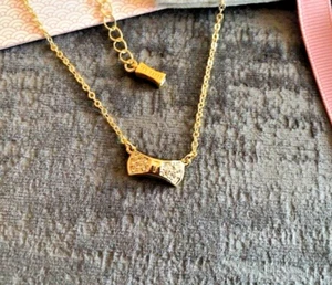 Ted Baker Crystal Pave Arch Bow Pendant Necklace Gold Tone - Picture 1 of 4