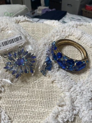 pulsera cristal azul y oro y folleto flor con 1 clip oreja Foto 1 de 4