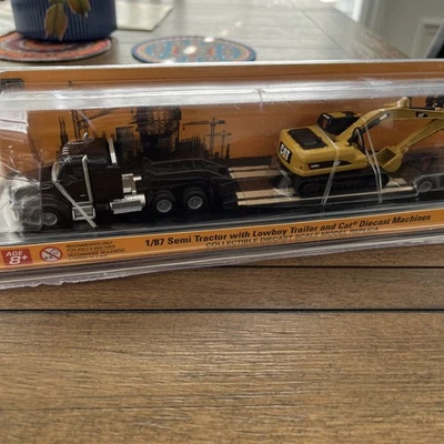 CATERPILLAR  N E W HO scale semi tractor with low boy trailer CAT load  1:87 - Image 1 of 4
