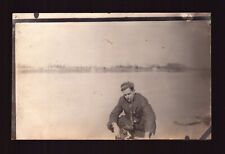 POSTCARD : RPPC - MAN WITH CIGAR & PUPPY - CYKO OUTLINE STAMP BOX