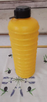 Bouillotte ancienne cylindrique marque « AMI » N° 27 plastique jaune vintage - Photo 1/4