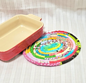 A pot stand made from various types of cotton strips made by a Japanese quilter