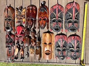collection hand carved African masks and figures
