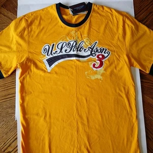 EE. UU. POLO ASSN. CAMISETA CUELLO REDONDO HOMBRE M AMARILLO/NEGRO RIBETE MANGA CORTA - Imagen 1 de 22