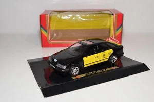 A80 1:24 GUILOY FORD SCORPIO TAXI BLACK WITH YELLOW BARCELONA MIB - Picture 1 of 14