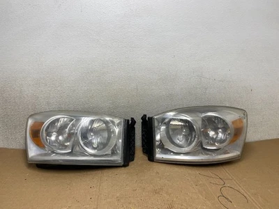 Juego de faros halógenos laterales izquierdo+derecho Dodge Ram 2006 a 2008 OEM U9910 DW Foto 1 de 4