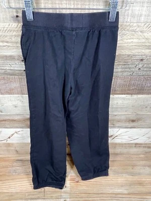 Pantalones deportivos Okie Dokie Match Up para niños (6 años) negros lisos con bolsillo en la rodilla Foto 1 de 4